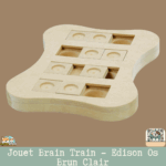 Le jouet Brain Train Edison Os Brun Clair avec ses compartiments à friandises.