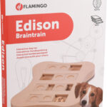 Un chien jouant avec le Brain Train Edison, découvrant des friandises sous les compartiments.