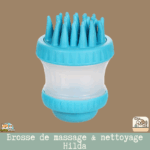 Brosse de massage et de nettoyage Hilda avec dents rondes en caoutchouc et réservoir de shampooing intégré.