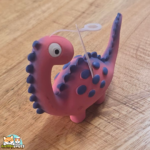 jouet Puga dinosaure en latex avec couineur pour chien