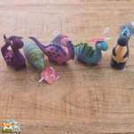 jouet Puga dinosaure en latex avec couineur pour chien