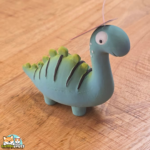 jouet Puga dinosaure en latex avec couineur pour chien