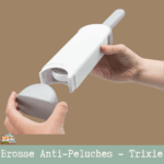 Brosse anti-peluches Trixie avec station de nettoyage automatique pour poils de chiens et chats sur tissus.